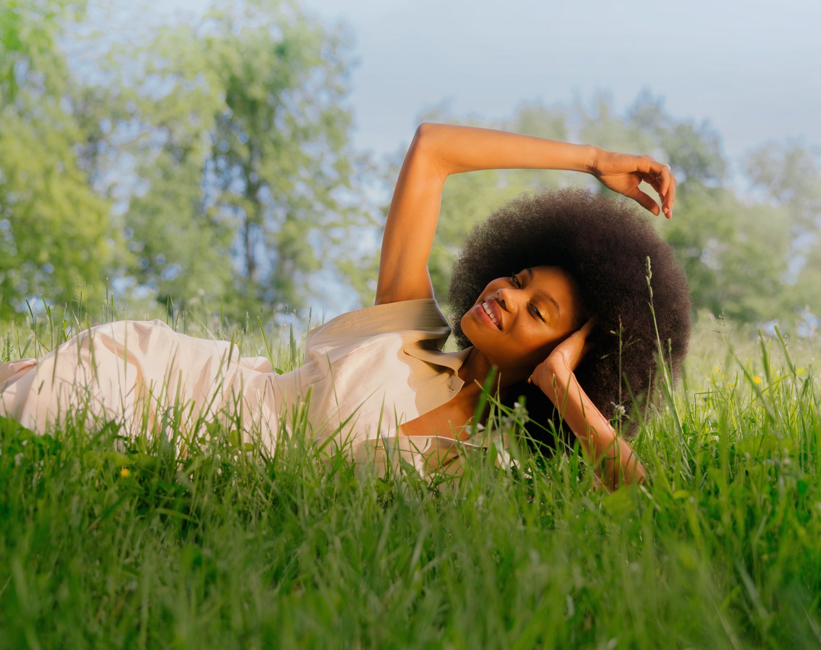 Future Society campaign — model lying in tall grass