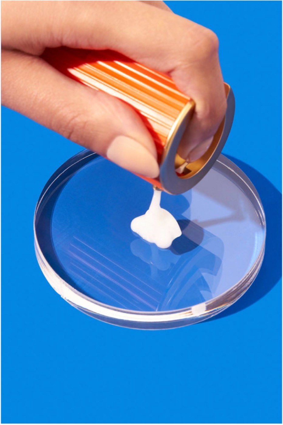 Serum poured onto a petri dish on blue